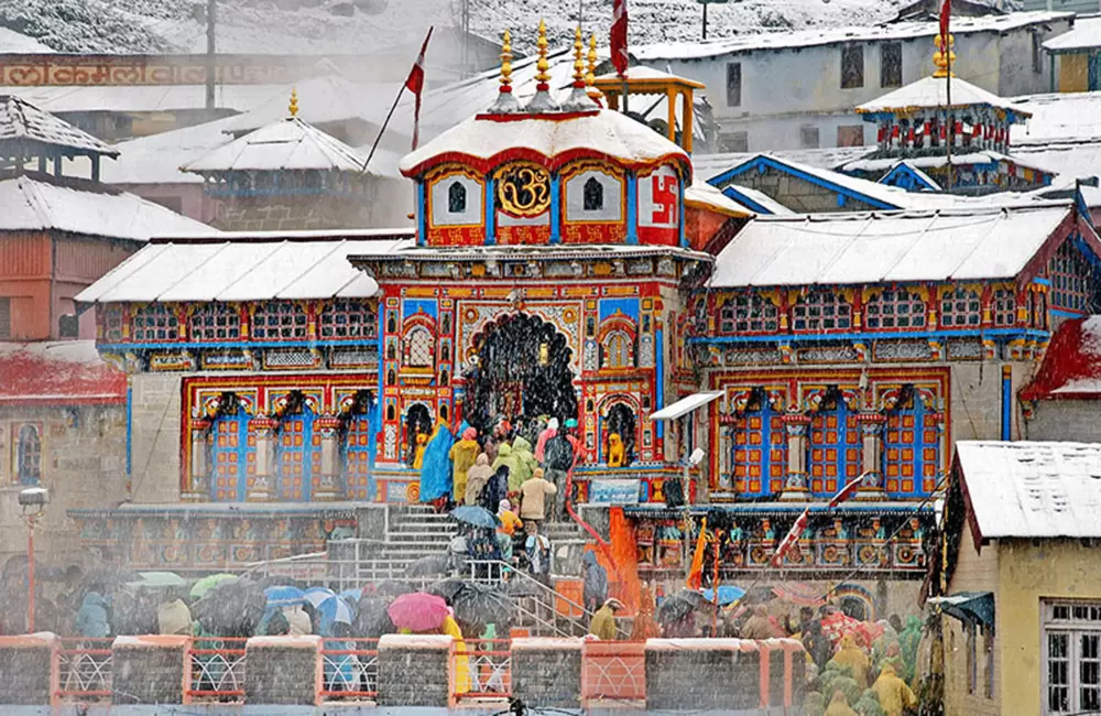 Snow fall at Badrinath - Devotees are waiting for their turn to enter in the temple. . Pic: Sirsendu Gayen 