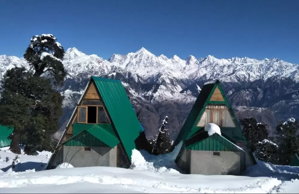 Munsiyari Eco Huts with backdrop of Panchachuli Ranges. Pic: Twitter Page of Trivendra Singh Rawat