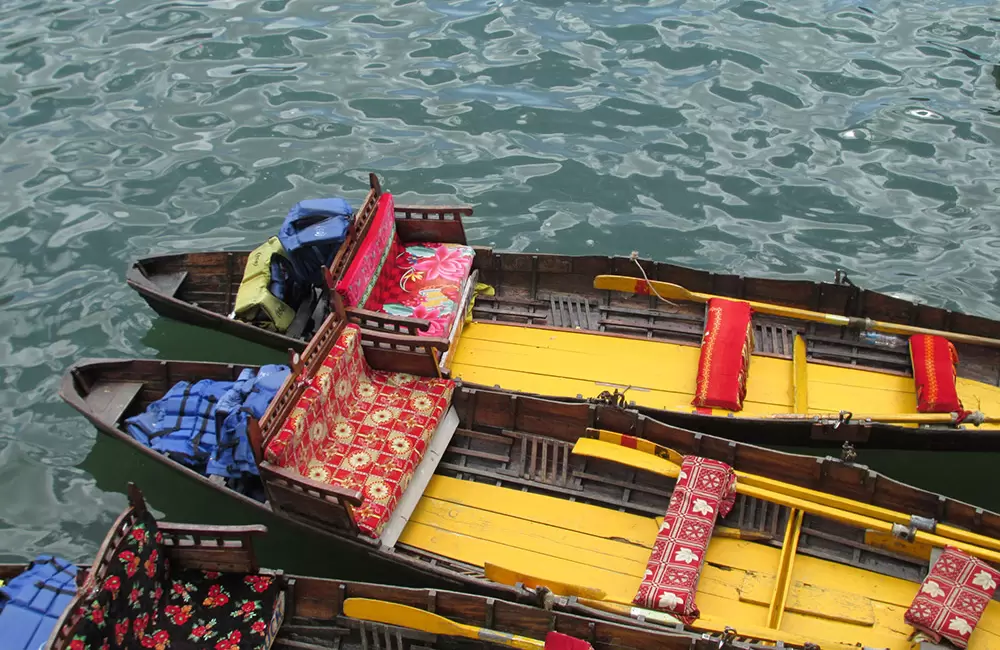 Colourful boats waiting for tourists to ride on in Naini Lake.. Pic: VB 