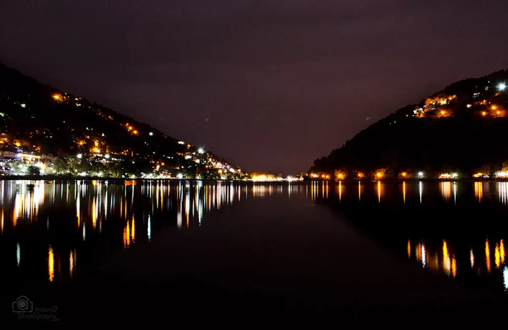 Night view of Naini lake with Nainital town mountains in the background.. Pic: Aryan592 