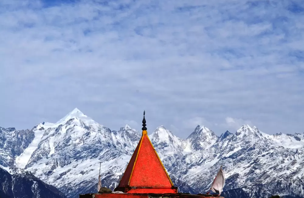 Kalmuni top offers splendid views of Pancachuli peaks and the pinnacle of the Hanuman temple adds a dash of colour.. Pic: Alpha 