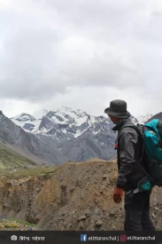 A trekker overlooking the Om parvat on the way of Aadi Kailash peak.