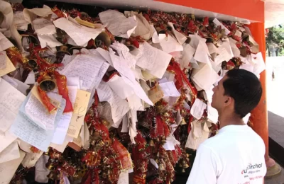 A visitor glancing over the letters from the devotess at Golu Devta Temple at Chitai near Almora
