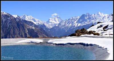 Artificial lake at Auli and Majestic Nanda devi peaks in the backdrop.