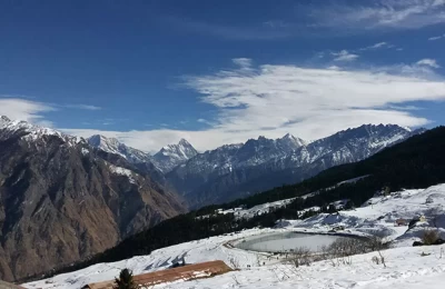 View of Artificial lake in Auli and Nanda Devi peaks in the background.