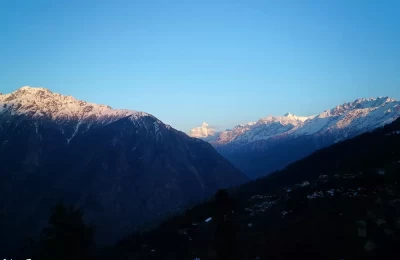 View of Nanda Devi and Trishul peaks from Auli, during sunset.