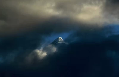 clouds overlap the Nanda Ghunti peak, in Chamoli