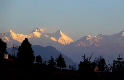 Beautiful view of snow capped mountains with golden sunshine from Chaukori.