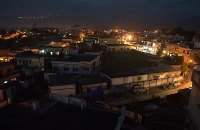 A view of Dehradun after sunset, with Mussoorie in the backdrop