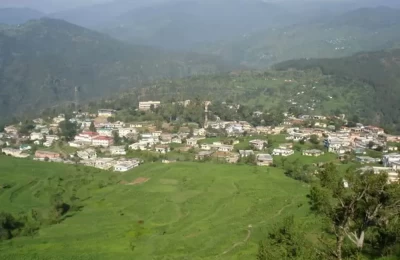 Green paddy fields and valley views in Gairsain