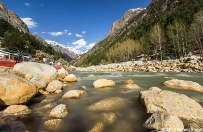 Ganga river flowing through the Gangotri(the origin of the river Ganga) and temples situated on the bank of Ganga river.