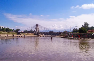 Ganga Ghat  and lord Shiva statue in the backdrop.