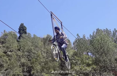 Cycling on wire at IKYA island, Mussoorie.