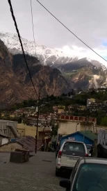 View of Joshimath town with beautiful snow capped mountains in the background.