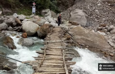 A small wooden bridge over a local river on the way to Kalpeshwar Mahadev temple.