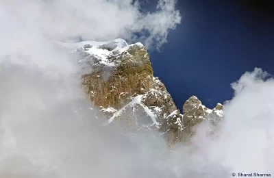 view of the Kedar peak surrounded by clouds.