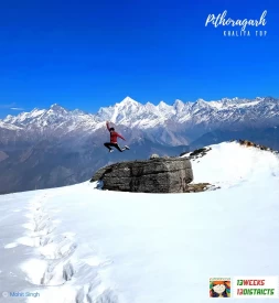 A man jumps into the snow at Khaliya Top