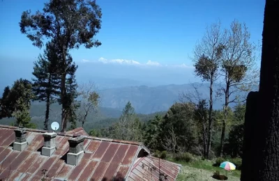 Mukteshwar valley and a beautiful view of Himalayan range in the backdrop.