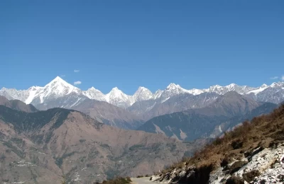 Photo was taken at the Munsiyari village, mountains which are shown in the picture are Panchchuli peaks. according to locals these five mountain peaks resembles five pandav (Mahabharat) brothers and there journey to heaven leads from here only.