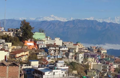 A beautiful morning view of Pauri Town in Uttarakhand and Himalayan range in the backdrop. 