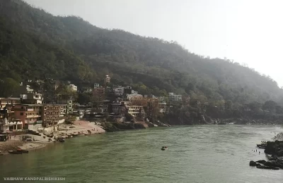 View of Holy Ganga river flowing through Rishikesh town.