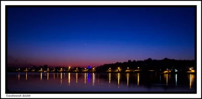 This Photograph is taken in evening hours at the bank of sacred river Ganga. The reflection of a temple and other light sources made it look beautiful