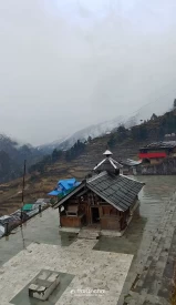 Someshwar Devta temple of Sankri after fresh snowfall in the nearby hills.