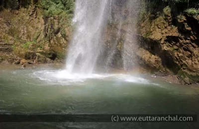 Pond with small rainbow formation