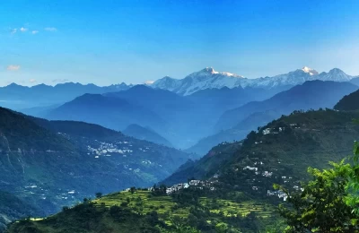 A beautiful view of both Ukhimath and Guptkashi towns.The backdrop is the mighty Kedarnath and the surrounding mountain ranges. This photo depicts the soul of Uttarakhand â€“ green landscape, vast stretch of Himalayan ranges, beautiful and simple townships, great religious power and peaceful atmosphere.