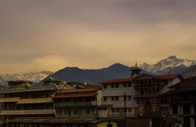 This photo depicts the Ukhimath temple with the background of Himalayas where lord Kedarnath ji and Lord Madhmaheshwar ji are worshiped in Winters.