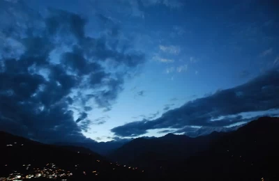 View of evening lights and clouds over beautiful Ukhimath mountains.