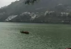 View of Bhimtal lake with beautiful colourful boats.