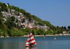 Beautiful Naini lake and ragatta on the foreground and Nainital town in the background. View Over Mallital Band Stand, Nainital 